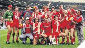  ??  ?? ■ Kenny and his Liverpool team-mates celebrate winning the 1986 FA Cup Final. But more recently, the competitio­n has seen empty seats, like at Hull City’s tie with Swansea last Saturday, watched by just 6608.