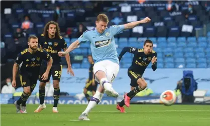  ?? Photograph: Peter Powell/ Reuters ?? Kevin De Bruyne slots home Manchester City’s second goal from the penalty spot in their 3-0 win over Arsenal.