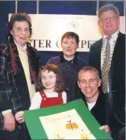  ?? ?? Lismore’s Shauna Kate Humphries proudly holds up her prizewinni­ng design with RTE personalit­y Ray D’Arcy at the Credit Union Poster Competitio­n awards ceremony in Dublin in March 2001. Also included are l-r: Eleanor Burns (Lismore and Cappoquin Credit Union), Kathleen Humphries and Jim McMahon (Credit Union president).