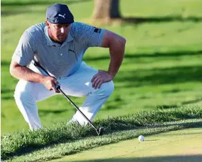  ??  ?? Ready to pounce: Bryson DeChambeau lines up a putt on the 17th green during the final round of the US Open. — AFP