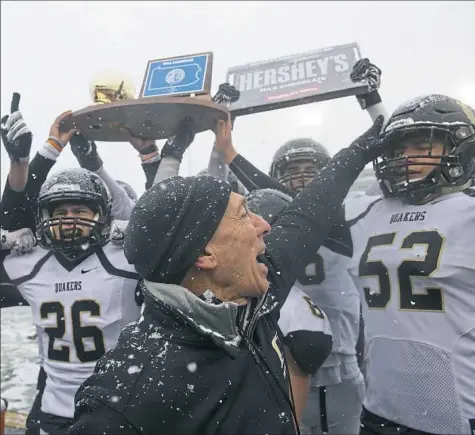  ?? Rebecca Droke/Post-Gazette ?? Quaker Valley coach Jerry Veshio and the Quakers football team gave fans plenty to celebrate after winning the PIAA Class 3A championsh­ip.