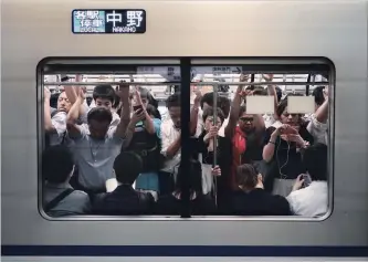  ?? JAE C. HONG THE ASSOCIATED PRESS ?? A study predicts 15 stations will experience greater than 200 per cent capacity, with several reaching nearly 400 per cent at their peak, during the 2020 Tokyo Olympics.