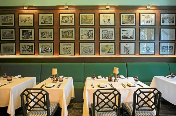  ?? PHOTOS BY KIMBERLY DELA CRUZ ?? The Grill, Manila House’s 2-month-old steak house, has a wall adorned with framed political cartoons.—