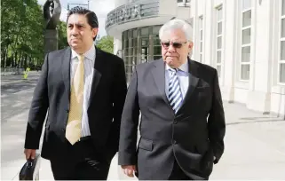  ??  ?? Former Guatemalan judge Hector Trujillo, right, leaves Brooklyn federal court after pleading guilty Friday in New York. (AP)