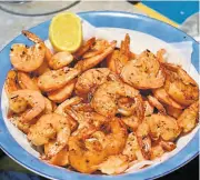  ?? ?? Perfectly sautéed unpeeled prawns, with a squeeze of lemon juice, and ready to be served.