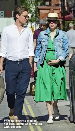  ??  ?? Princess Beatrice cradled her baby bump while walking with Edoardo