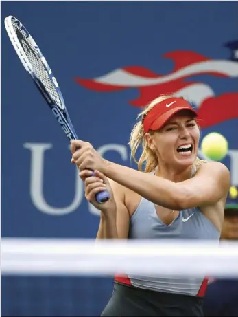  ??  ?? In this Aug. 27, 2014, file photo, Maria Sharapova, of Russia, returns a shot to Alexandra Dulgheru, of Romania, during the second round of the U.S. Open tennis tournament, in New York. AP PHOTO/JASON DECROW