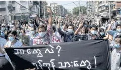  ??  ?? AFFIRMING RIGHTS: Protesters hold a banner that reads, ‘Who are we? Yangon residents’ during a demonstrat­ion against the military coup in Yangon on Friday.