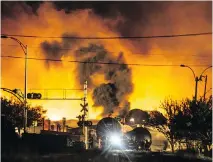  ?? DARIO AYALA ?? Train cars carrying crude oil burn in the town of Lac-Mégantic, 100 kilometres east of Sherbrooke, on July 6, 2013.