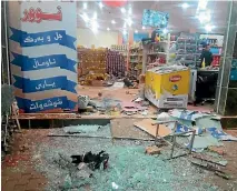  ?? PHOTO: REUTERS ?? A damaged storefront is seen after an earthquake in Halabja, Iraq.