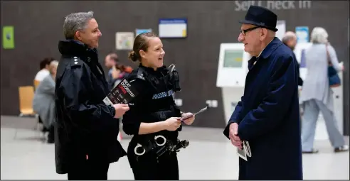  ??  ?? Chief Inspector David Pettigrew with Michelle Quinn of Community Safety Glasgow and Fredrick Tod From Crookston launching the bogus caller initiative at Queen Elizabeth University Hospital Pictures: Mark Gibson