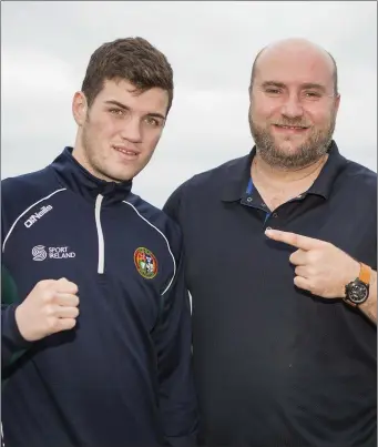  ??  ?? Jordan Myers with his father and coach, Thomas Myers. Pic: Donal Hackett.