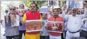  ??  ?? Akhand Rajputana Sevasangh activists protest outside filmmaker Sanjay Leela Bhansali’s office in suburban Juhu against his upcoming movie 'Padmavati' on Sunday.