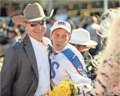  ?? IVAN PIERRE AGUIRRE ?? Horse trainer Joel H. Marr hugs jockey Ken S. Tohill after winning the 18th running of the Sunland Derby with their horse, “Wild on Ice” (not pictured) last March at Sunland Park Racetrack & Casino.