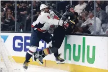  ?? ASSOCIATED PRESS FILE PHOTO ?? Washington Capitals’ Alex Ovechkin puts Vegas Golden Knights’ Brayden McNabb into the boards during Game 2 of the Stanley Cup final Wednesday night in Las Vegas. The series is tied 1-1.