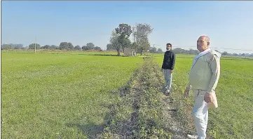  ?? HT PHOTO ?? Ramesh Sharma (in white) and Satish Kumar Sherawat (in black) at Singhu village.