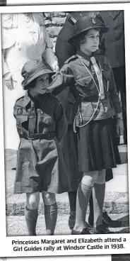  ?? ?? Princesses Margaret and Elizabeth attend a Girl Guides rally at Windsor Castle in 1938.