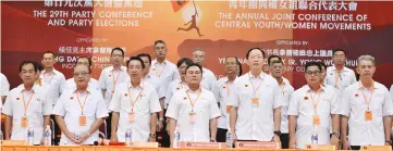  ??  ?? Chin (centre), Teo (third right), Yong (third left) and party leaders sing the national and state anthems.