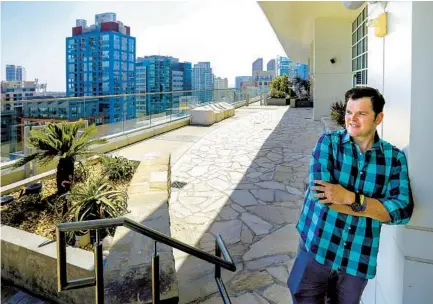  ?? U-T FILE ?? Chef Travis Swikard stands on an eighth-f loor patio of the East Village building where his restaurant, Callie, will open.