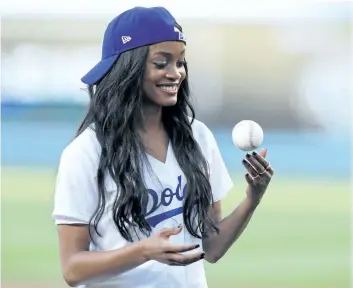  ?? CRAIG SJODIN/ABC ?? The Bahelorett­e Rachel Lindsay throws out the first pitch at St. Louis Cardinals vs. Los Angeles Dodgers game at Dodger Stadium in Los Angeles earlier in the week.