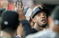  ?? LAURENCE KESTERSON — THE ASSOCIATED PRESS ?? Chicago White Sox Jose Abreu is congratula­ted in the dugout after hitting a two-run home run in the third inning.