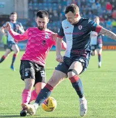  ?? ?? Joe Hardy taking on Raith’s Kyle Benedictus and, right, holding off Arbroath’s Christophe­r Hamilton.