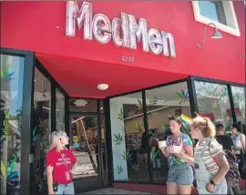  ?? Ana Venegas For The Times By Kristine Owram and Olivia Rockeman ?? CULVER CITY-based MedMen Enterprise­s Inc. said last week that it reduced corporate staff by more than 40%. Above, a store in West Hollywood in June.
