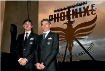  ?? PHOTO: GETTY IMAGES ?? Wellington Phoenix head coach Darije Kalezic and assistant coach Rado Vidosic pose in front of the new Phoenix logo.