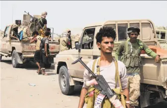  ?? AFP / Getty Images ?? Yemeni pro-government forces advance toward the port city of Hodeida, controlled by Houthi rebels, as they continue to battle for the control of the city,