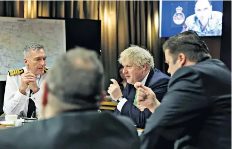  ?? ?? Boris Johnson is briefed by Admiral Sir Tony Radakin, the Chief of the Defence Staff, at the Ministry of Defence