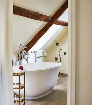  ?? ?? ABOVE LEFT Amiata bath, from £3,641.80; Staffordsh­ire 26 freestandi­ng bath mixer with handheld shower attachment, from £1,950, both Victoria + Albert