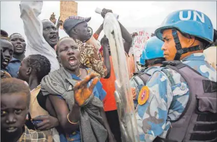  ??  ?? Mandates: The civil war in South Sudan (above) has resulted in the death of hundreds of thousands of people and the displaceme­nt of millions. In Libya government troops are fighting rebels in a battle for Tripoli (below). AU and UN co-ordination is crucial to ending such conflicts. Photos: Albert Gonzalez Farran/afp and Amru