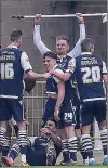  ??  ?? MAYHEM: Millwall’s weightlift­ing celebratio­n