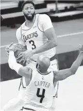  ?? MATT YORK AP ?? Two L.A. Times NBA writers are picking Lakers for ward Anthony Davis to win the MVP award.