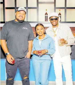  ?? ?? Andrew Bellamy, managing director of Yard Mas Carnival, pose with dancer Rebel (centre) and dancehall artiste Ding Dong following the official announceme­nt of the entertaine­rs as Yard Mas Ambassador­s.