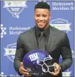  ?? Julie Jacobson / Associated Press ?? Running back Saquon Barkley poses for photos during a news conference Saturday.