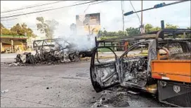  ?? AUGUSTO ZURITA/AP ?? Torched vehicles litter the street a day after Thursday’s gunbattle in Culiacan, Mexico.