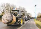  ?? ANDREA MANTOVANI NYT ?? Farmers depart in their tractors for Paris in a protest procession in Agen, France, on Monday.