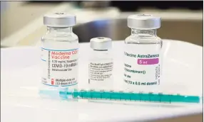  ?? Thomas Kienzle / Getty Images ?? Connecticu­t health officials say it’s preferred, but should not be required, for a person to receive both doses of the vaccine at the same location.