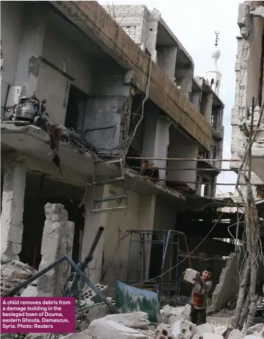  ?? Photo: Reuters ?? A child removes debris from a damage building in the besieged town of Douma, eastern Ghouta, Damascus, Syria.