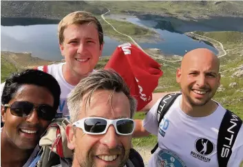  ??  ?? Fundraisin­g Rutherglen Lawn Tennis Club members, including club president Gareth Ellor (front) completed the three peaks challenge to help raise money for the campaign and they will be even happier to have received £70,000 from the LTA and Tennis Scotland