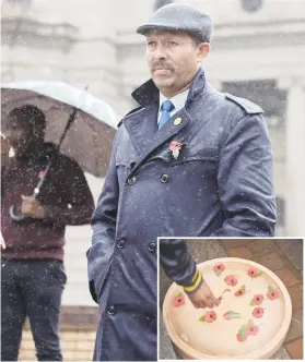  ?? Picture: Alaister Russell Picture: Michel Bega ?? LEST WE FORGET. A man wearing a remembranc­e poppy braves the rain during the commemorat­ion day of the 100-year anniversar­y of the sinking of the SS Mendi yesterday at Beyers Naude Square in the Johannesbu­rg CBD. Inset: Members of the public float...