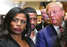  ?? AFP / Getty Images file photo ?? Omarosa Manigault Newman, shown with President Donald Trump in 2015, claims that she has heard a tape of Trump using the N-word, dating from his years hosting “The Apprentice.”