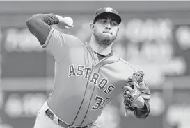  ?? Jim Mone / Associated Press ?? Hector Rondon made his fifth appearance for the Astros on Wednesday, throwing a scoreless inning, which included a strikeout, to keep his ERA at 0.00. Josh Reddick