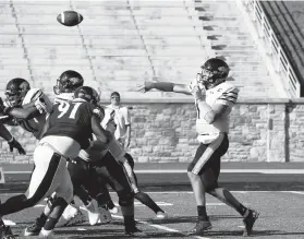  ?? BARBARA HADDOCK TAYLOR/BALTIMORE SUN ?? Towson quarterbac­k Chris Ferguson throws a touchdown pass in the first half of Saturday’s 31-0 win over Morgan State. Ferguson passed for 269 yards and two touchdowns in his Tigers debut after transferri­ng from Liberty.