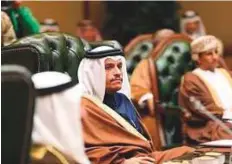  ??  ?? Left: Qatar’s Foreign Minister Shaikh Mohammad Bin Abdul Rahman Al Thani attends a GCC meeting earlier this year in Kuwait ■ amid frosty ties with neighbours. Right: Doha airport has lost around 25 per cent of its traffic due to the Arab boycott.