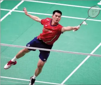  ?? AP ?? China’s Zhao Junpeng reaches for a return during his match against Indonesia’s Anthony Ginting at the Thomas Cup on May 12. Zhao was defeated in a 3-0 quarterfin­al loss for China.