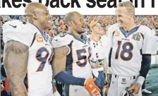  ?? AP ?? GOOD TIMES: DeMarcus Ware (left), Von Miller and Peyton Manning share a moment during Denver’s 24-10 win.