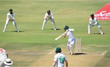  ??  ?? Pakistan's Abid Ali plays a shot during his unbeaten knock of 215 against Zimbabwe in Harare on Saturday