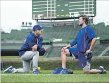  ?? Wally Skalij Los Angeles Times ?? MANAGER Dave Roberts chats with pitcher Clayton Kershaw before Game 1 of the NLCS. Kershaw will start Game 2.